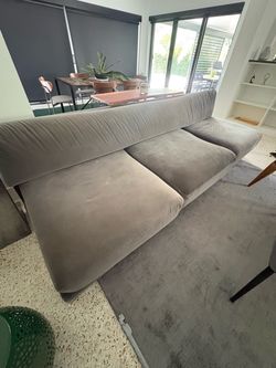 Modern suede grey couch with small chrome legs