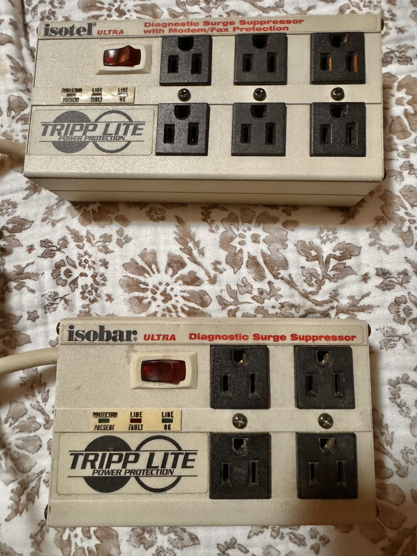 Two Tripp lite surge protector outlets