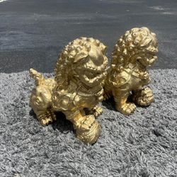 Two golden Asian dragon statues made of resin … 12 “ high , 12” long , 7 “ depth.