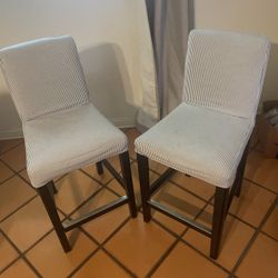 IKEA BERGMUND bar stool with a blue and white pinstripe cover