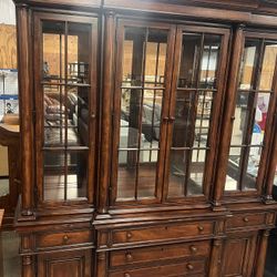 Thomasville china cabinet. Used in good condition with some cosmetic blemishes. There are some scratches and scuff marks in different areas there are 