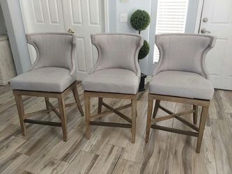 Three beautiful counter Height swivel bar stools