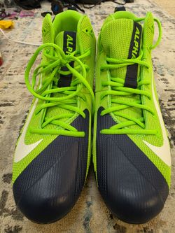 Neon green and dark blue Nike Alpha Menace Football cleats