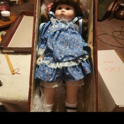 REDUCED TO $20.00

Collectible porcelain doll...she comes with her box...approximately  18" tall...she originally cost $69.00...buy her for $30.00

