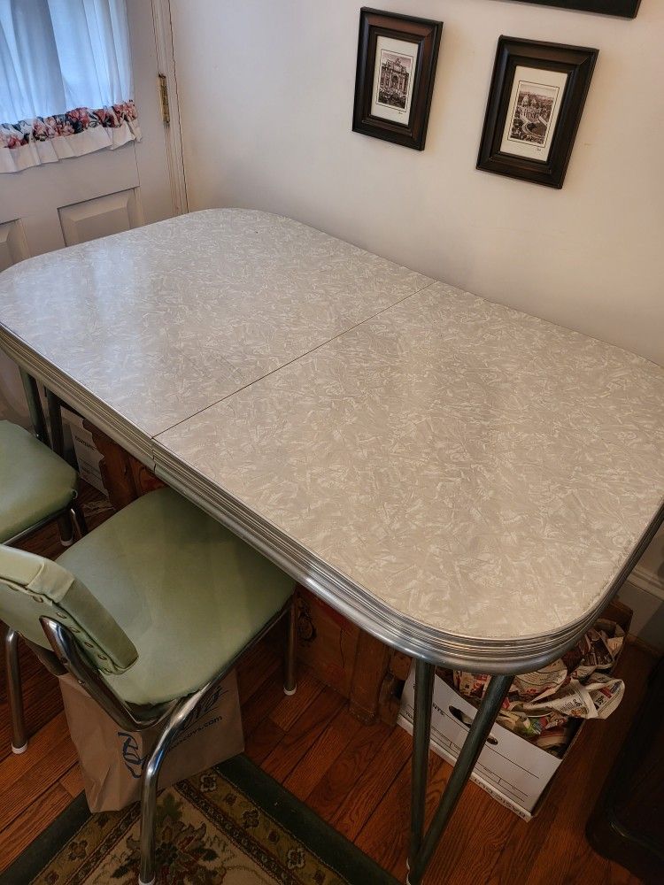 vintage chrome table ...great shape...5 chairs need recovering...only 50