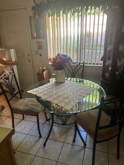 Round glass, dining table, and chairs