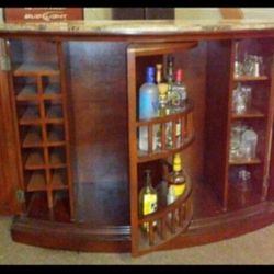 Marble Top Bar With Stools And Glasses