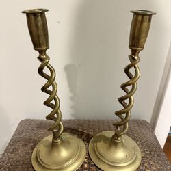A Pair Of Brass Candle Sticks