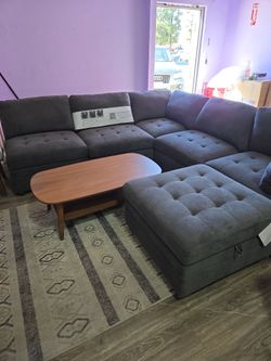 Gray Tufted Sectional Sofa with Ottoman