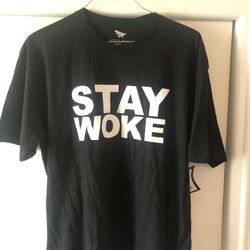 “STAY WOKE” Roc Nation Paper Planes Tee