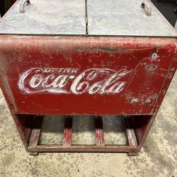 Coke 1939 Ice Chest Machine Coke 1939 Ice Chest Machine.  Original doors are inside but a new lid was made for it.  Has a bottle tray on the bottom.  