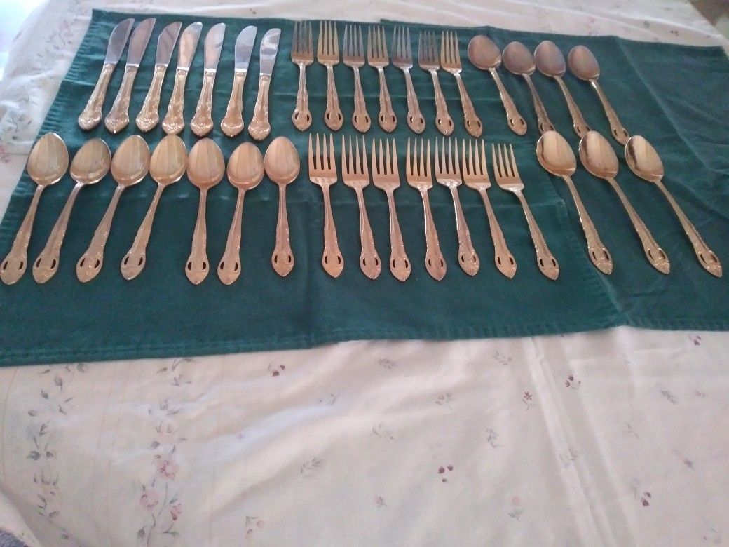 H.F Ltd ( Hanford Forge) Stainless Golden Color ,Plated Pierced Rose Utensils Set of 35. Woodland Hills Ca.