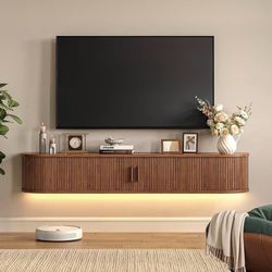 63" Floating TV Stand with Power Outlet for TVs up to 75", Fluted Entertainment Center with Remote Control for LED Lights, Mid-Century Modern TV Conso