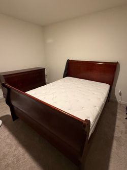 Bed frame with mattress and adjustable base