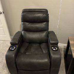 Two reclining chairs, and a side table