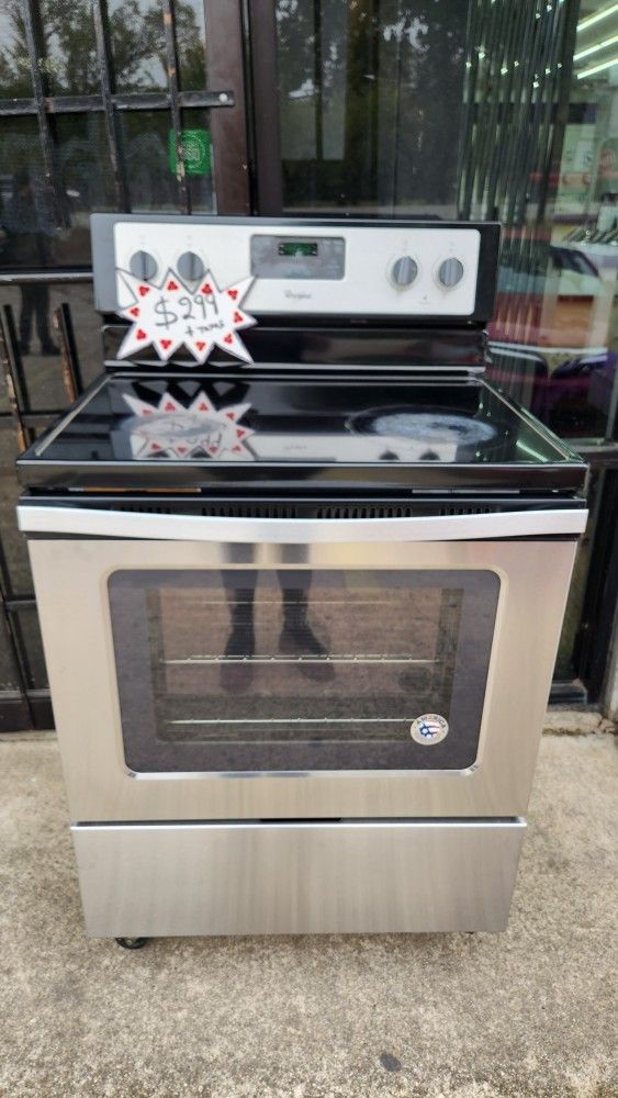 Semi-new stainless steel glass electric stove in excellent condition, 30 days warranty, visit us