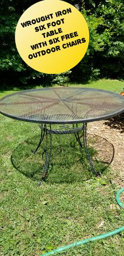 Outdoor wrought iron table with six free chairs