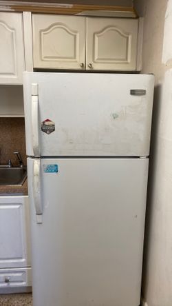 Frigidaire refrigerator.  A bit dirty, but good working condition.