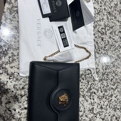 Versace black leather clutch bag
