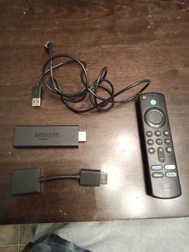 Amazon Fire TV Stick (2nd gen) with remote, cable, and HDMI Extender.