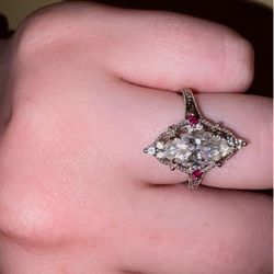 10k White gold marquis engagement ring with ruby side stones
