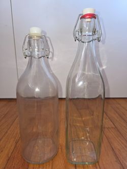GLASS bottles with stoppers $8
