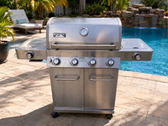 Delivery Available! Monument Grills Stainless Steel 4 Burner Gas Propane BBQ Grill with 2 Side Burners! Works Great! Does not include propane tank. In