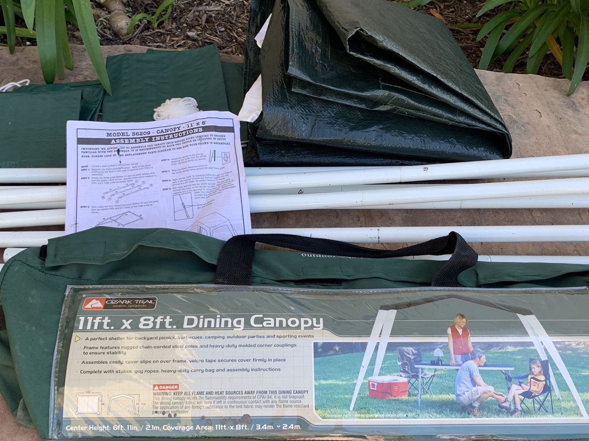 NEW - Ozark Trail Dining Canopy 11ft X 8ft. Green heavy duty carry bag Stakes,steel poles,corner couplings,guy ropes & instructions. Great for backy
