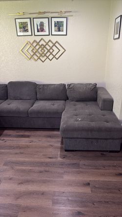 Large grey sectional with some removable stains
