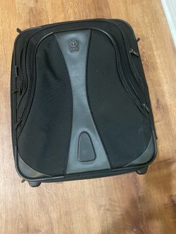 Tumi black carry on bag