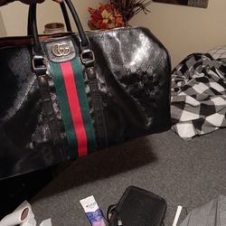 1 GUCCI DUFFLE BAG, MADE IN ITALY, I PURCHASED THIS BAG BACK IN 2021, AND IT WAS OVER 3 THOUSAND DOLLARS,, THANK YOU,  HONESTLY,  CARL COLEMAN