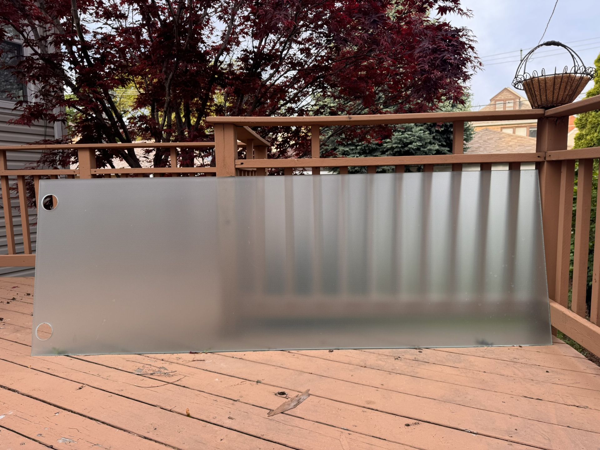 Large frosted glass panel with mounting holes