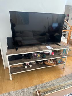 Wood and white metal TV stand.