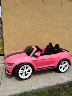 Fisher-Price pink ride-on toy car modeled Ford Mustang,