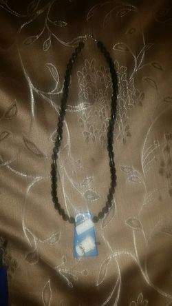 Black necklace with a blue pendant (purse and coffe)