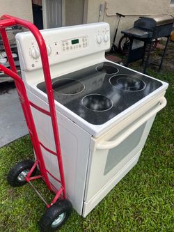 GE stove biscuit color  3 months  warranty  includes