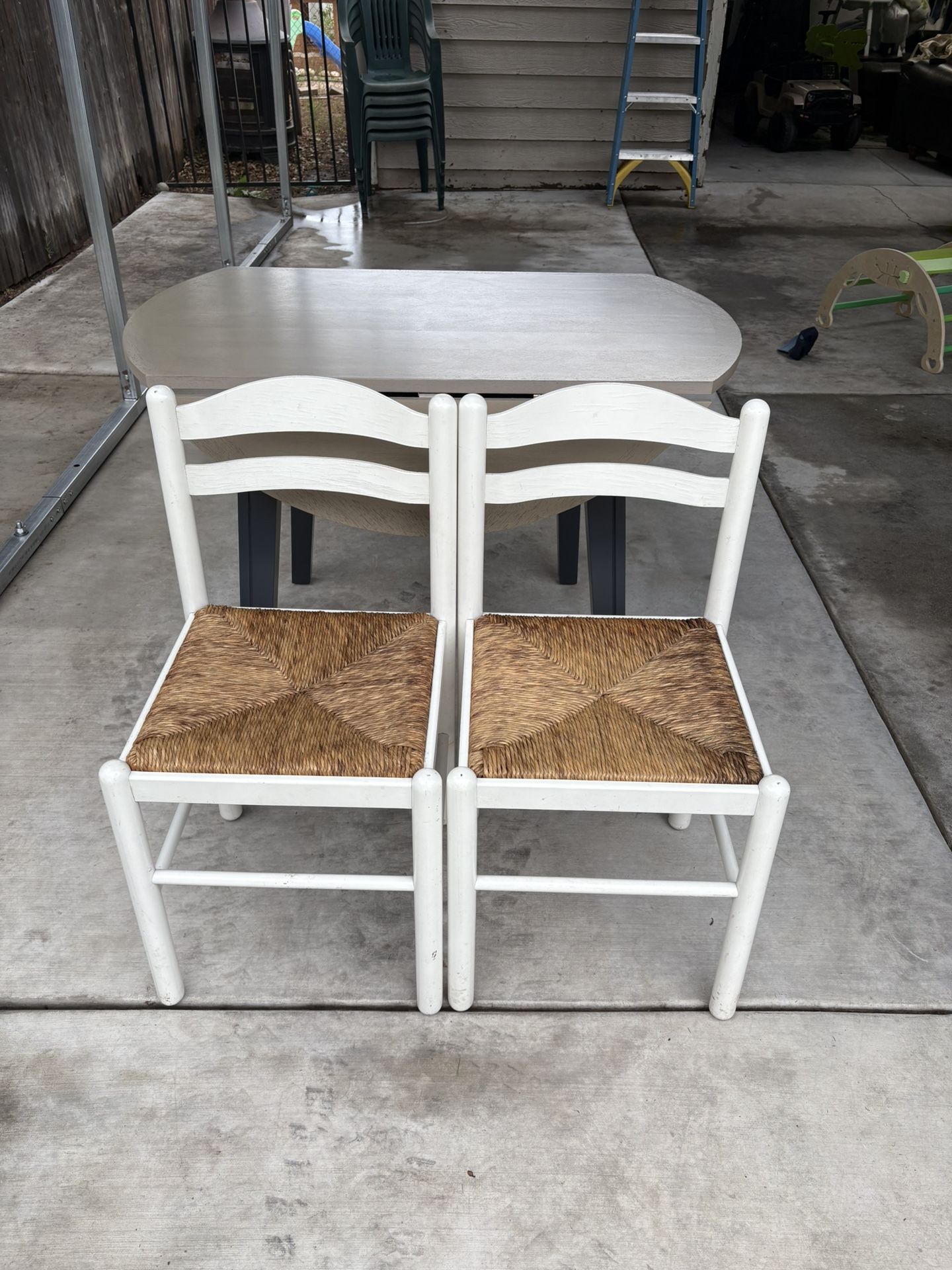 Two White Wicker Chairs