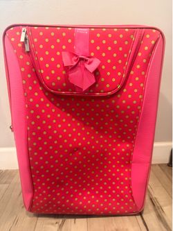 Large hot pink luggage