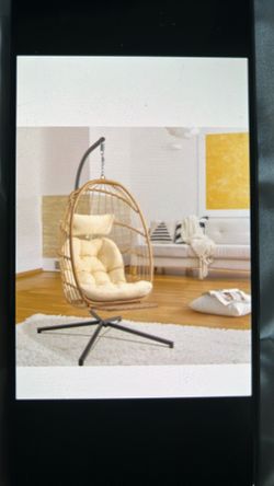 Rattan egg chair with beige Cushions