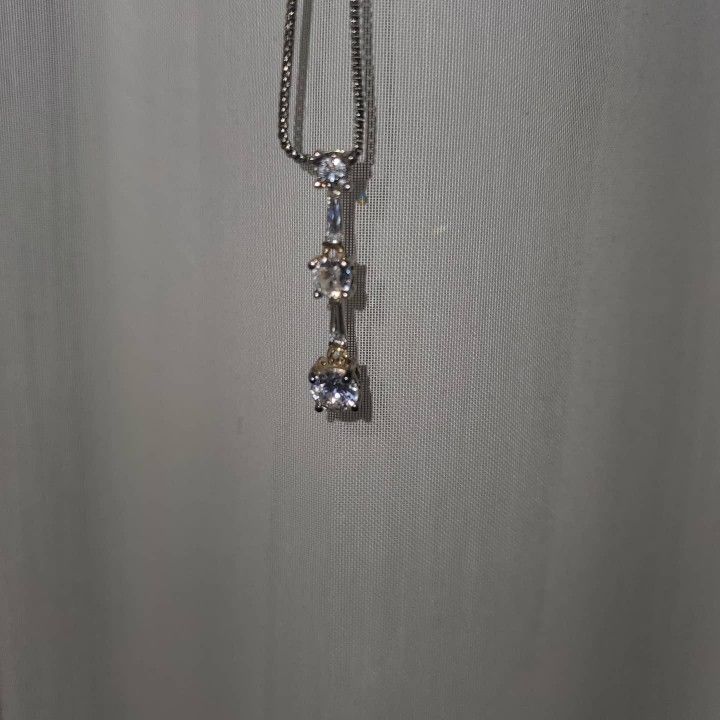 Past present and future pendant with baguettes in between