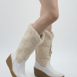 Juicy Couture Quilted Fur Lined Tall Snow Boots featuring a mid-height wedge heel