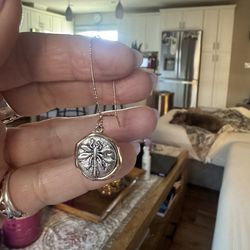 Silver/gold metal earrings. Dragonfly’s