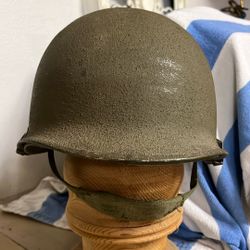 Authentic U.S. M1 Steel Combat Helmet, likely Korean War to Vietnam-era configuration (approximately 1950s–1970s).