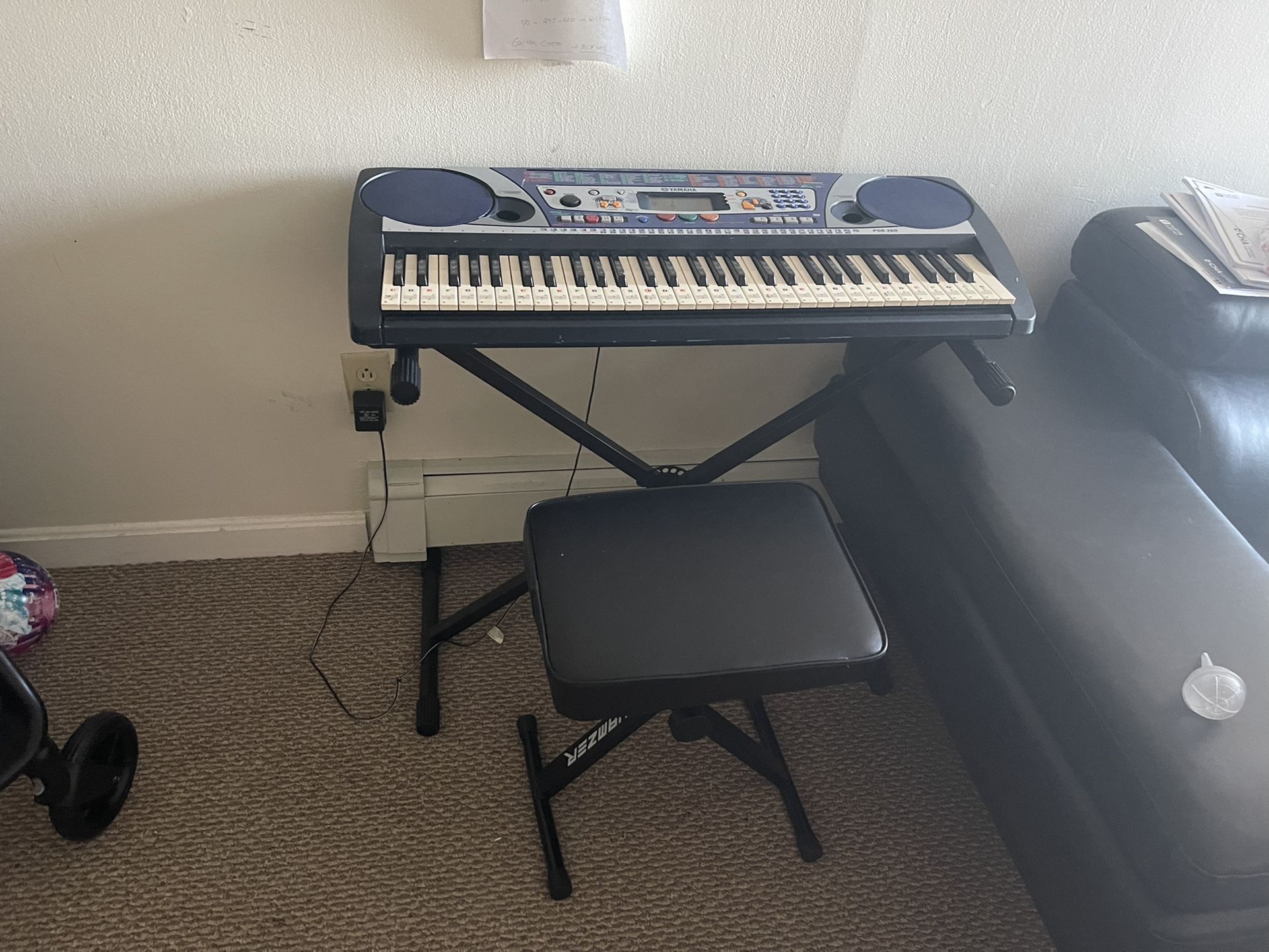 Music keyboard with stand and seat.  Various musical options.  Reason for sale: change of state, my car is small.