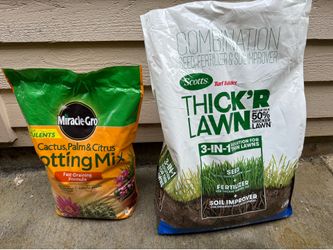 Lot of Cactus palm potting mix and turf builder grass seeds