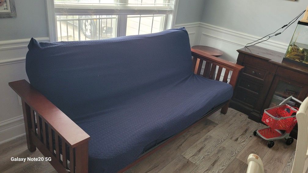 Wooden Futon With Blue Waterproof Cover