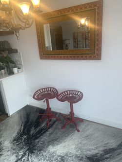 Beautiful mirror and 2 rustic counter chair.