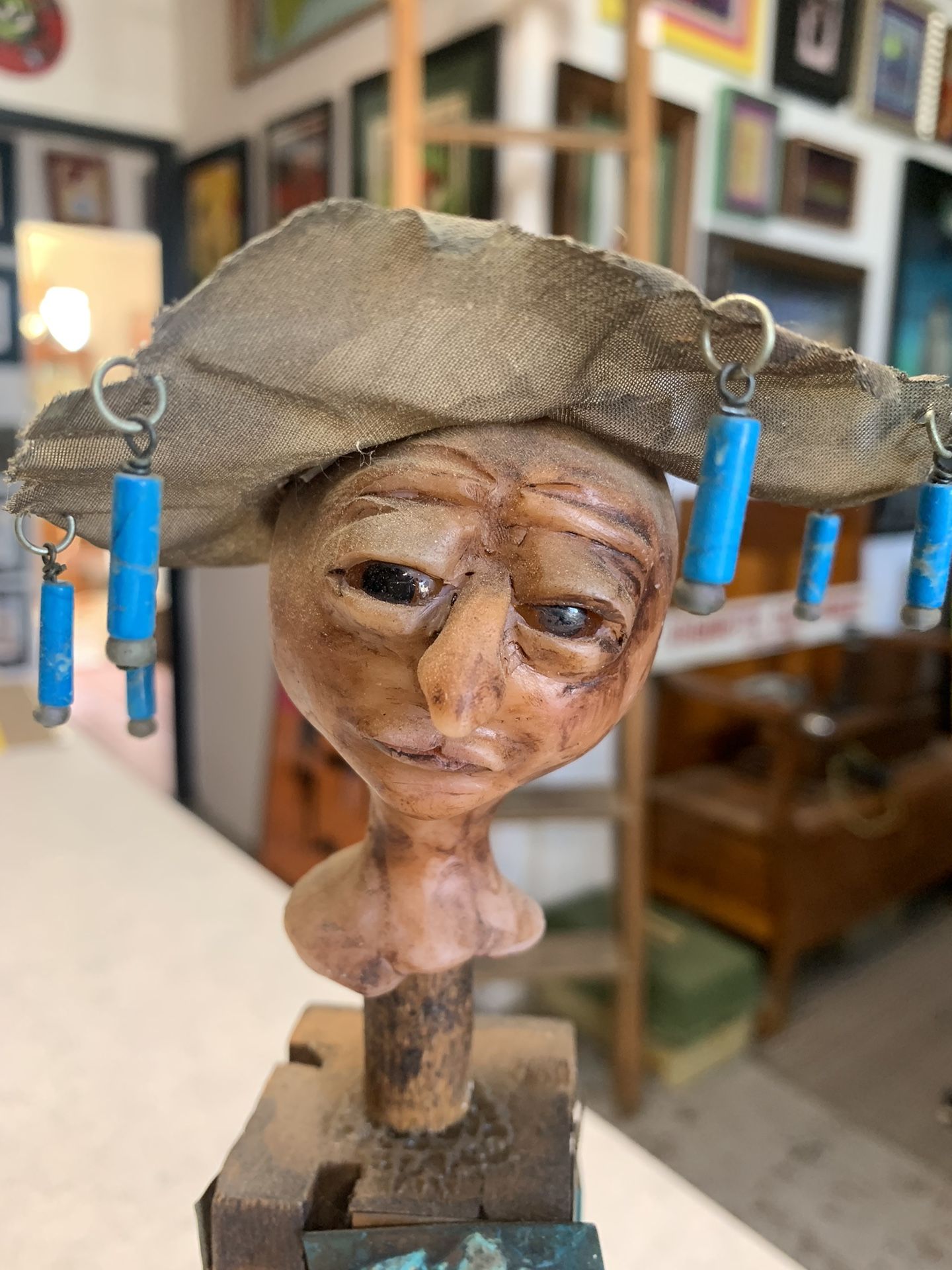Sculpture Of A Person Wearing A Hat