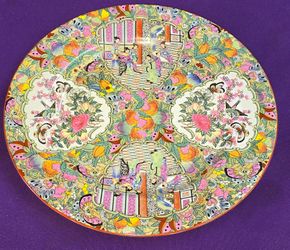 Vintage Chinese Rose Medallion porcelain plate featuring a hand-painted famille rose style design with figures, flowers, and birds.
A68M011