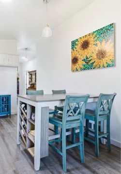 Ashley dining room table and 4 chairs with wine rack on side from Old Cannery